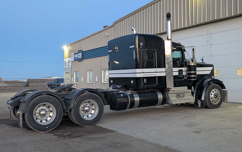 A truck hooked up to heavy-duty equipment repair machines.