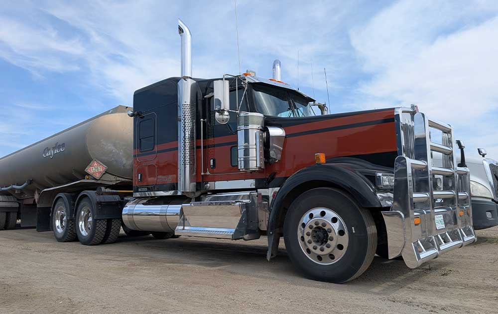 A truck being worked on by a heavy duty mechanic.